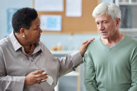 Therapist helping a patient